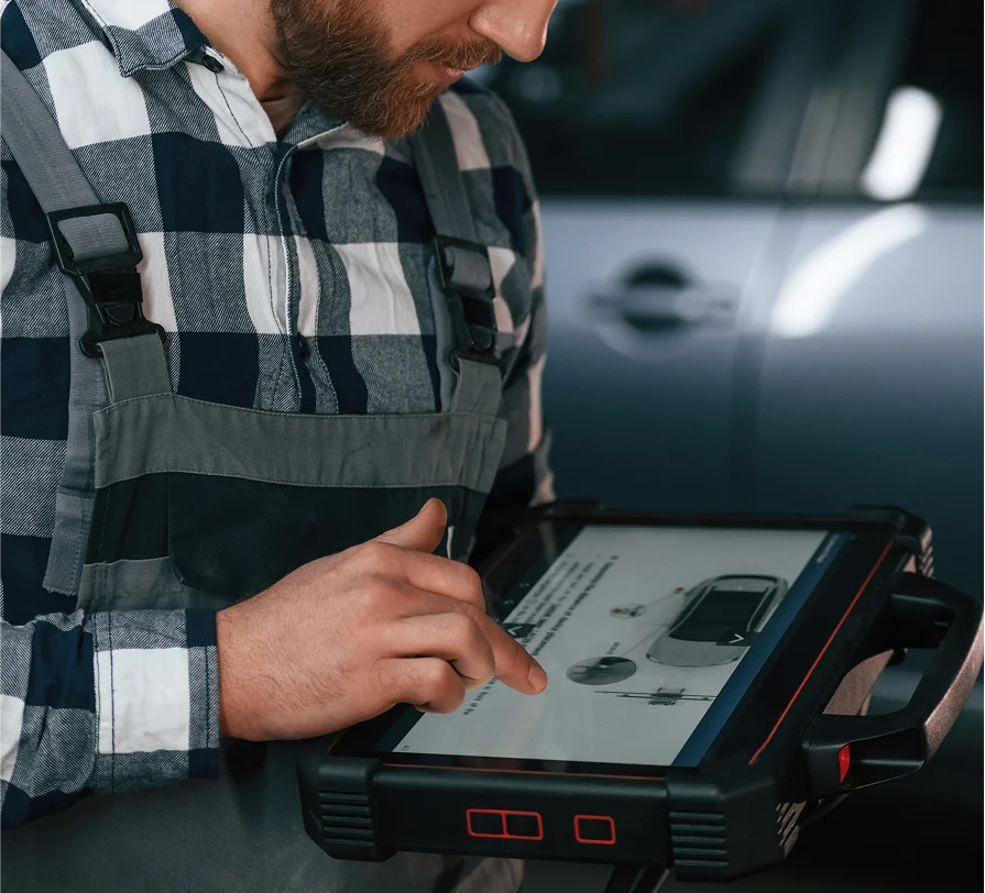 An auto mechanic working in the app